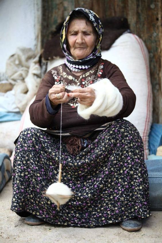A Turkmen lady from Konya spins wool with drop spindle, Cental Turkey, 2017