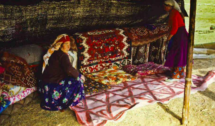 Sachikara Turkmen tribeswoman, with the kilim she wove, Kahramanmarash, Eastern Turkey, photo courtesy Josephine Powell, Suna Kıraç Foundation