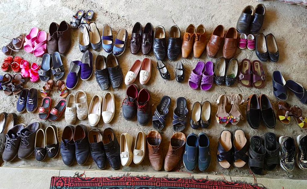 Shoes taken off in fron ot the door of a village house