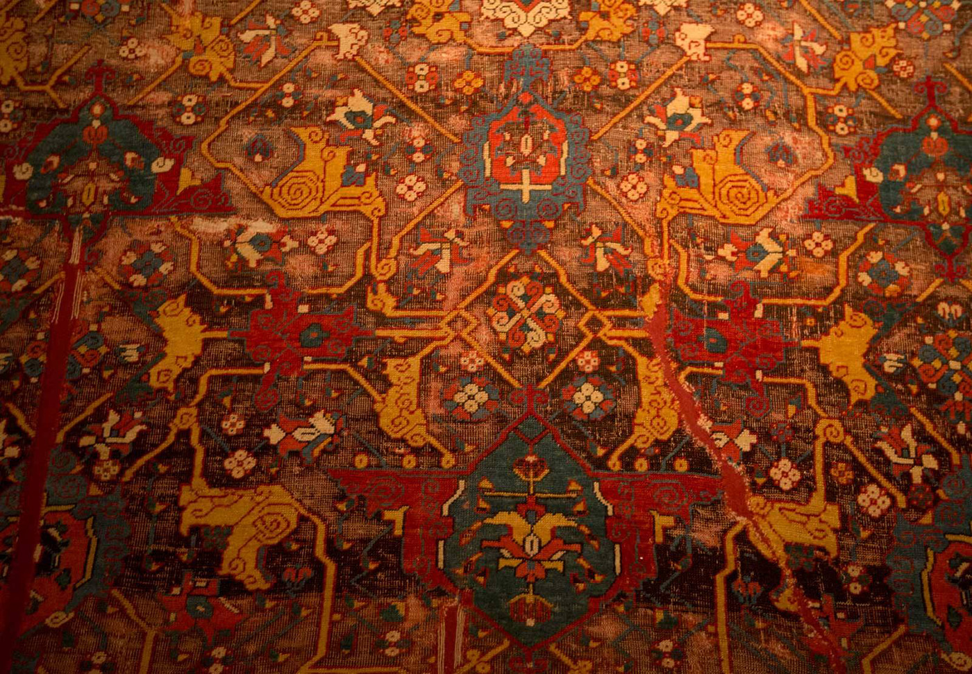 15th century Eastern Anatolian workshop carpet with very fine structure and floral and cloudband patterns with Persian Effect. Vakiflar Museum